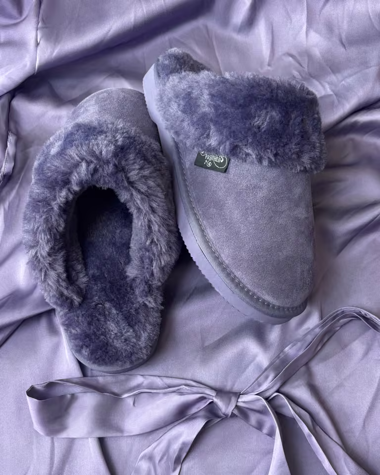 The Elysian in Lavender Fog, soft violet shearling slippers on lavender satin