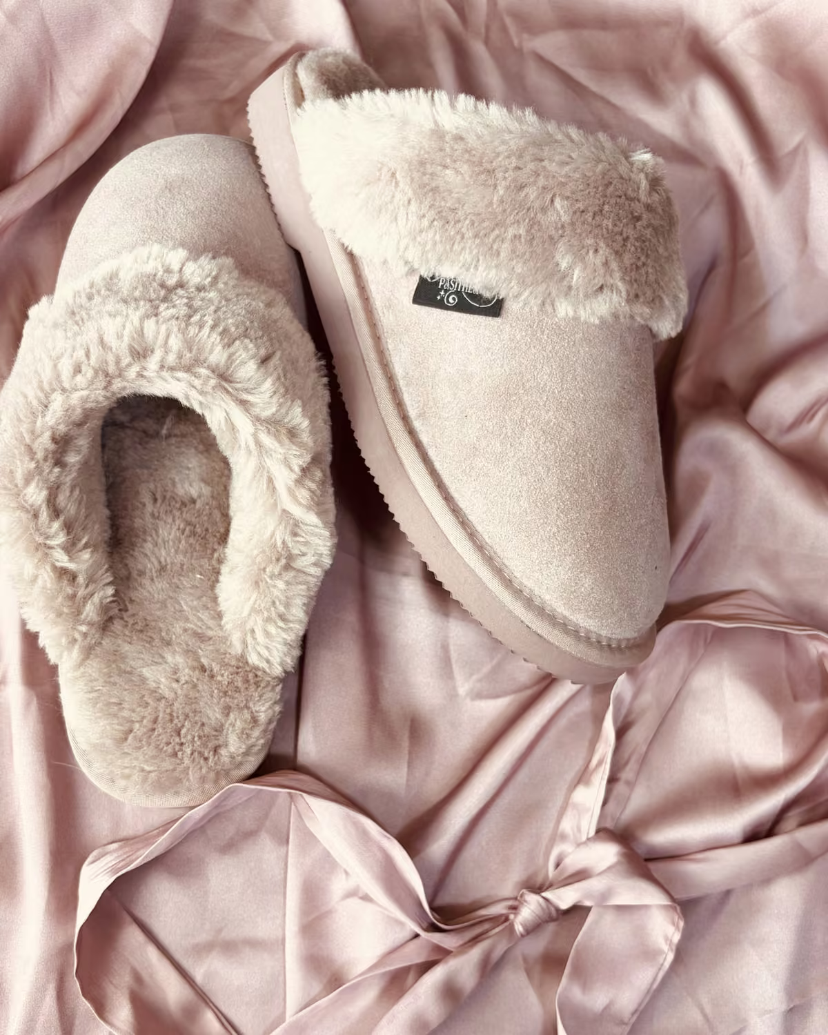The Elysian in Rosewater, pale pink shearling slippers on blush satin